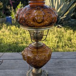 Vintage 22.5" Amber Glass Electric Hurricane Lamp with Cherub Faces & Brass Base

