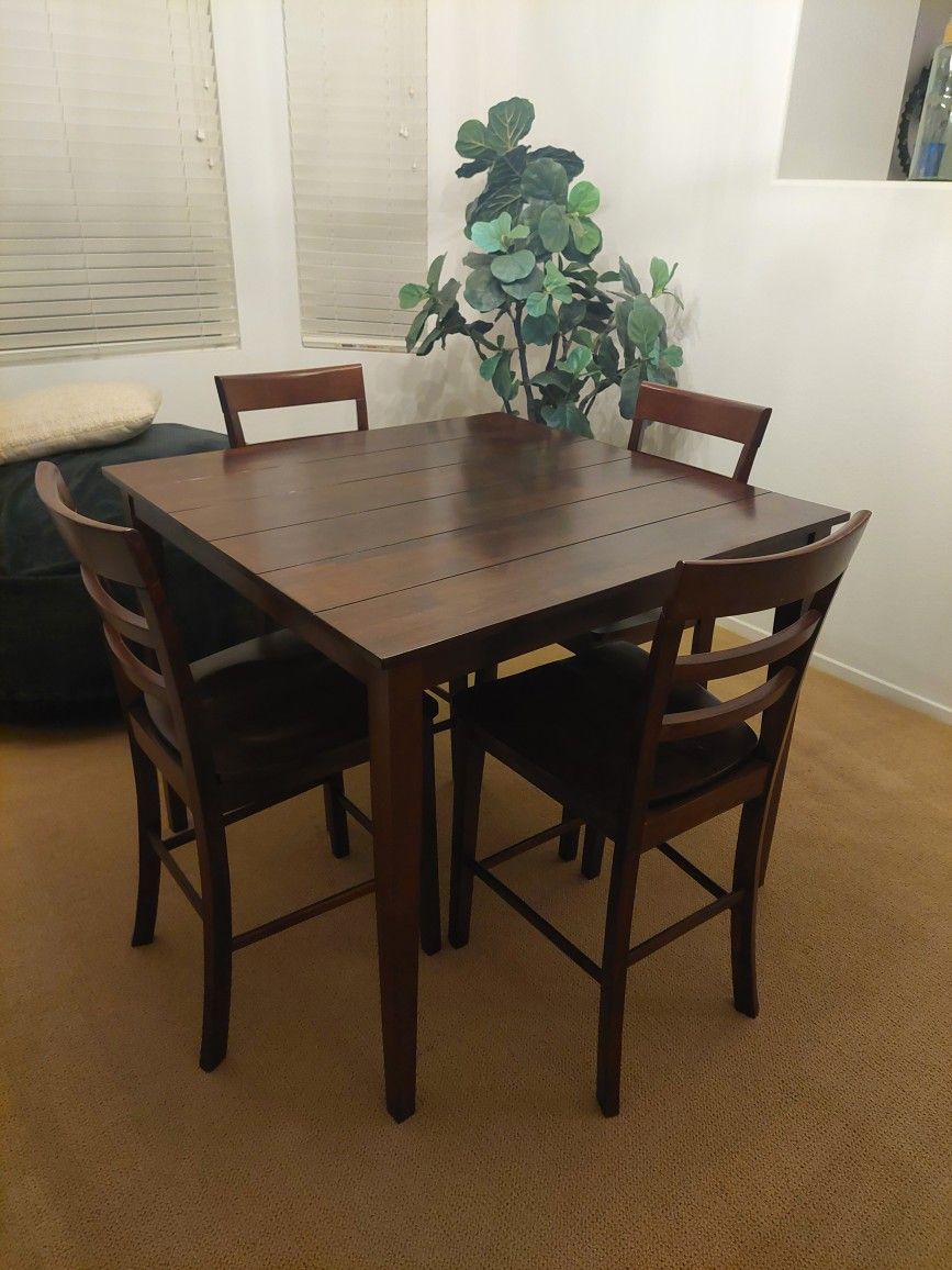 Bar height dining table and chairs.