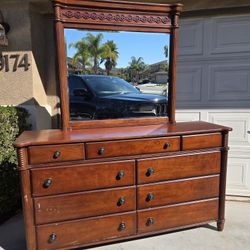 Large wood dresser with mirror (mirror can detach).
