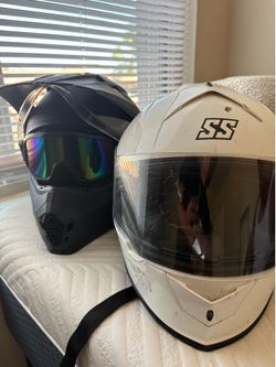 2 helmets and goggles