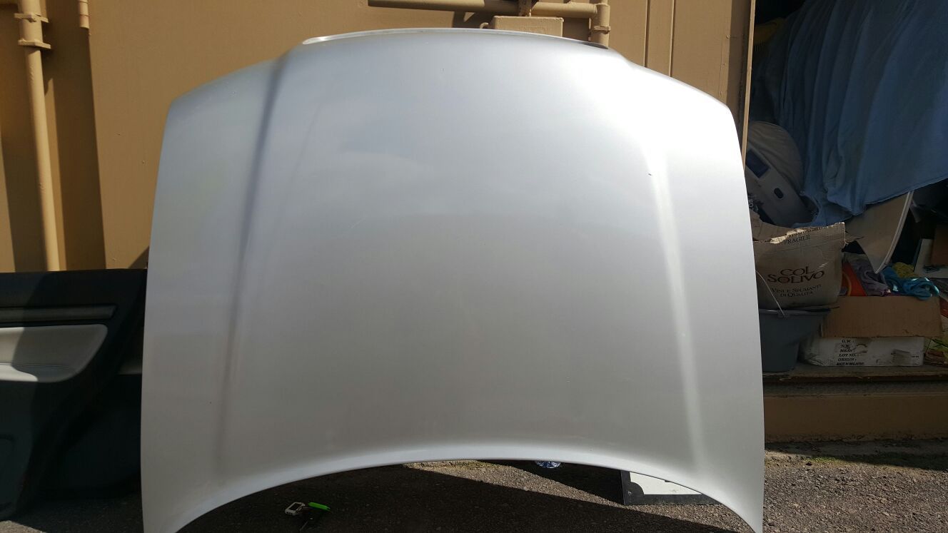 B5 Audi S4 silver hood and rear bumper w/ valance.
