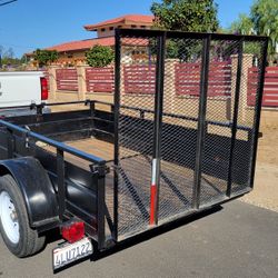 8 by 5 utility landscape trailer..... metal sides.... drop gate .... California title 