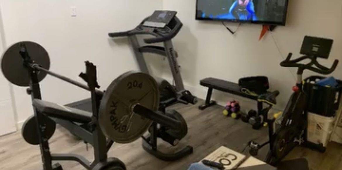 Home Gym. Bench w/ Weights. Treadmill. Cycle
