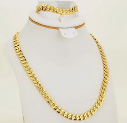 New 18 k yellow gold Cuban link chain and bracelet