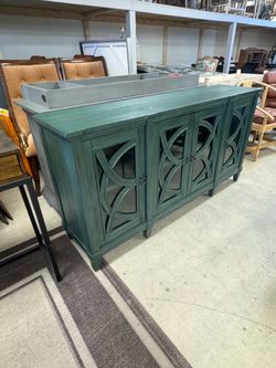 67" Accent Console in green with intricate wooden cutouts