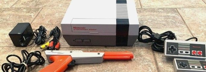 Regular Nintendo W. Remotes And Duck Hunting Gun