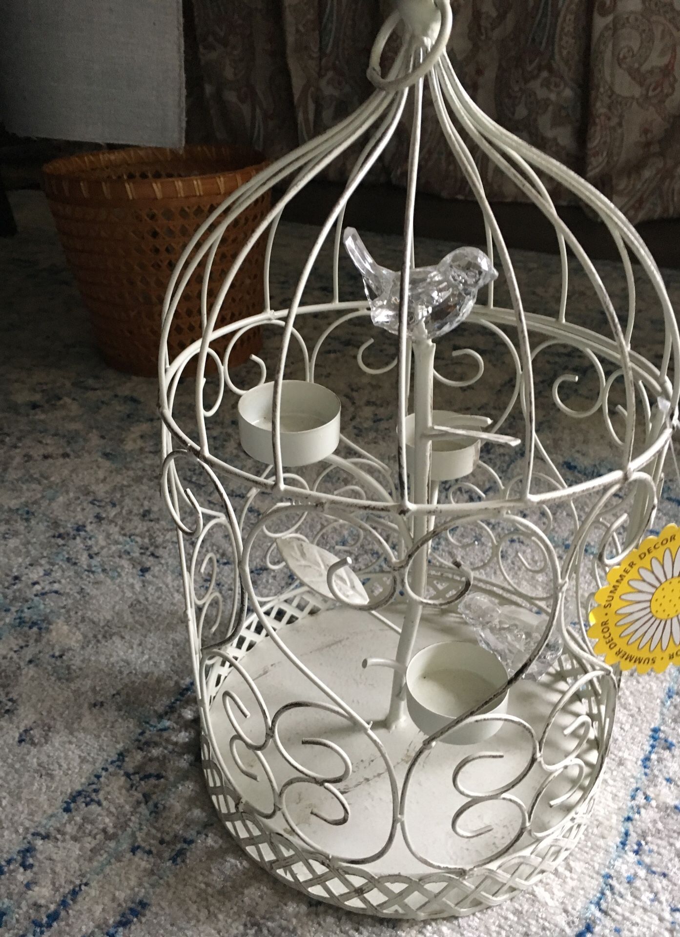 Bird cage with birds and candle holders