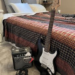 Squier Stratocaster electric guitar with Fender amp