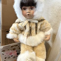 Vintage Porcelain Faced Alaskan Native American Treasure  There is a small hole on the top of her pants which the jacket completely covers 