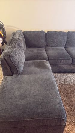 Grey sectional with ottoman
