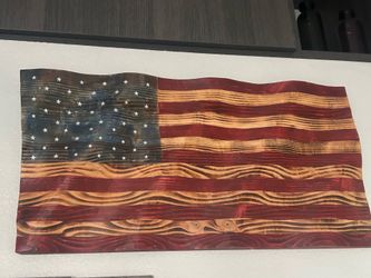 Crafted waved American flag 31 wide by 16 height.