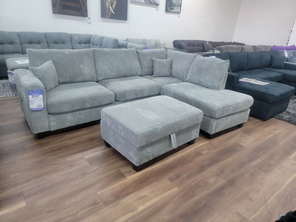New 2pc Sectional And Storage Ottoman In Fog Corduroy 