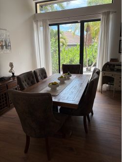 Solid wood dining room table with extender and eight chairs