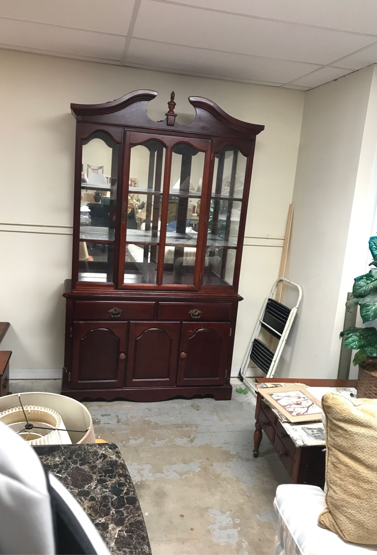 Nice solid wood 1970s China cabinet with four shelves two drawers and lots of storage also has a light