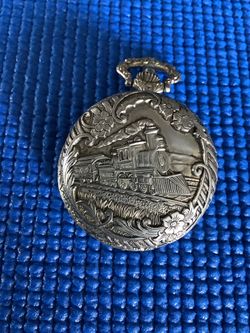 BEAUTIFUL GENEVA POCKET WATCH,     RAILROAD ENGINE DESIGN.  $65 OBO