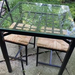 brand new and fully assembled glass topped wicker seat dining set