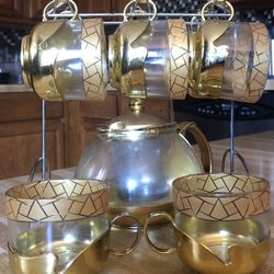 Glass tea kattle and 8 glass cups with stand