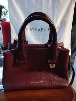 Michael Kors Rollins Small Snake-Embossed Leather Satchel in the oxblood/bordeaux colorway, crafted from pebbled leather with matching snake-embossed 