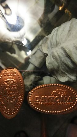 One Willie Nelson enlongated penny an one enlongated Daytona penny