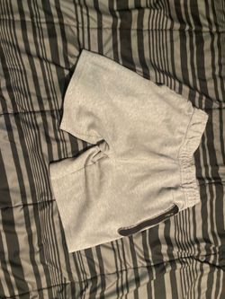 Grey Nike tech shorts size large  grade school/teen  40$