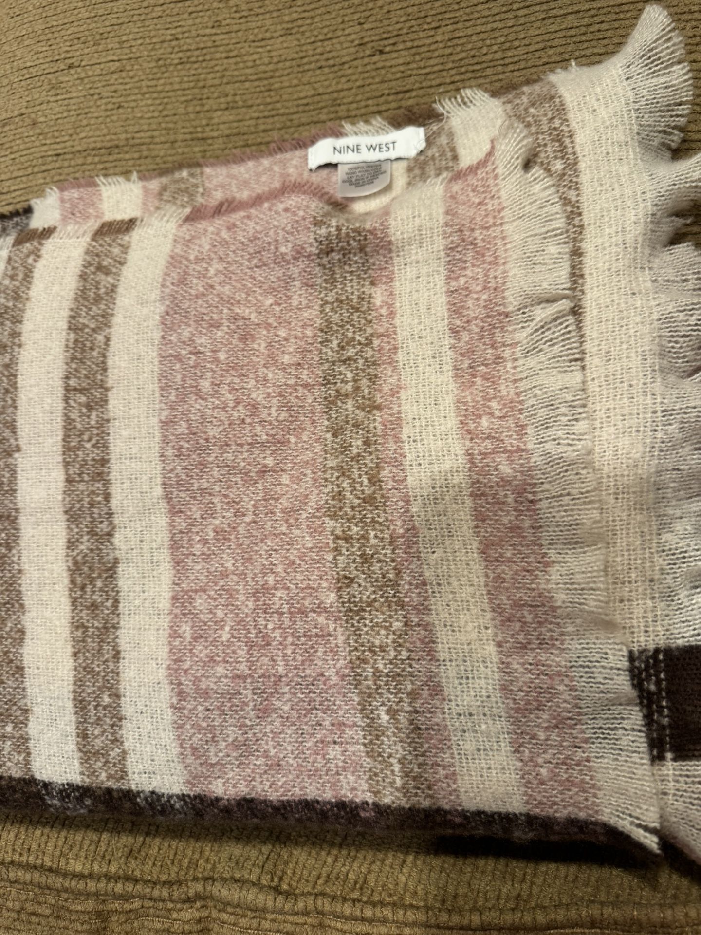 NWOT women’s Nine West beige, pink and brown plaid scarf/wrap 70” x 22” See photos for complete details and description Material is 100% polyester