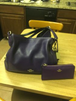 Purple Coach hand bag with matching wallet
