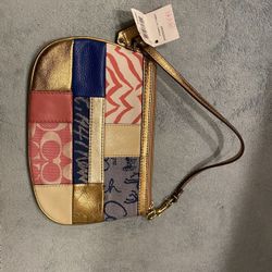 Brand new coach pouch never been used.
