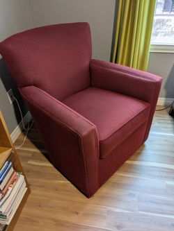 Burgundy upholstered Ethan Allen swivel chair