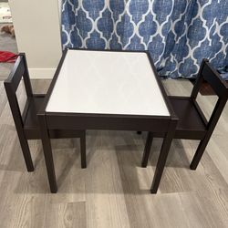 Kids table and chairs set Great for crafts, drawing, or snack time.