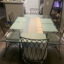 6 chairs dinning table with metal frame,glass top and cushions
