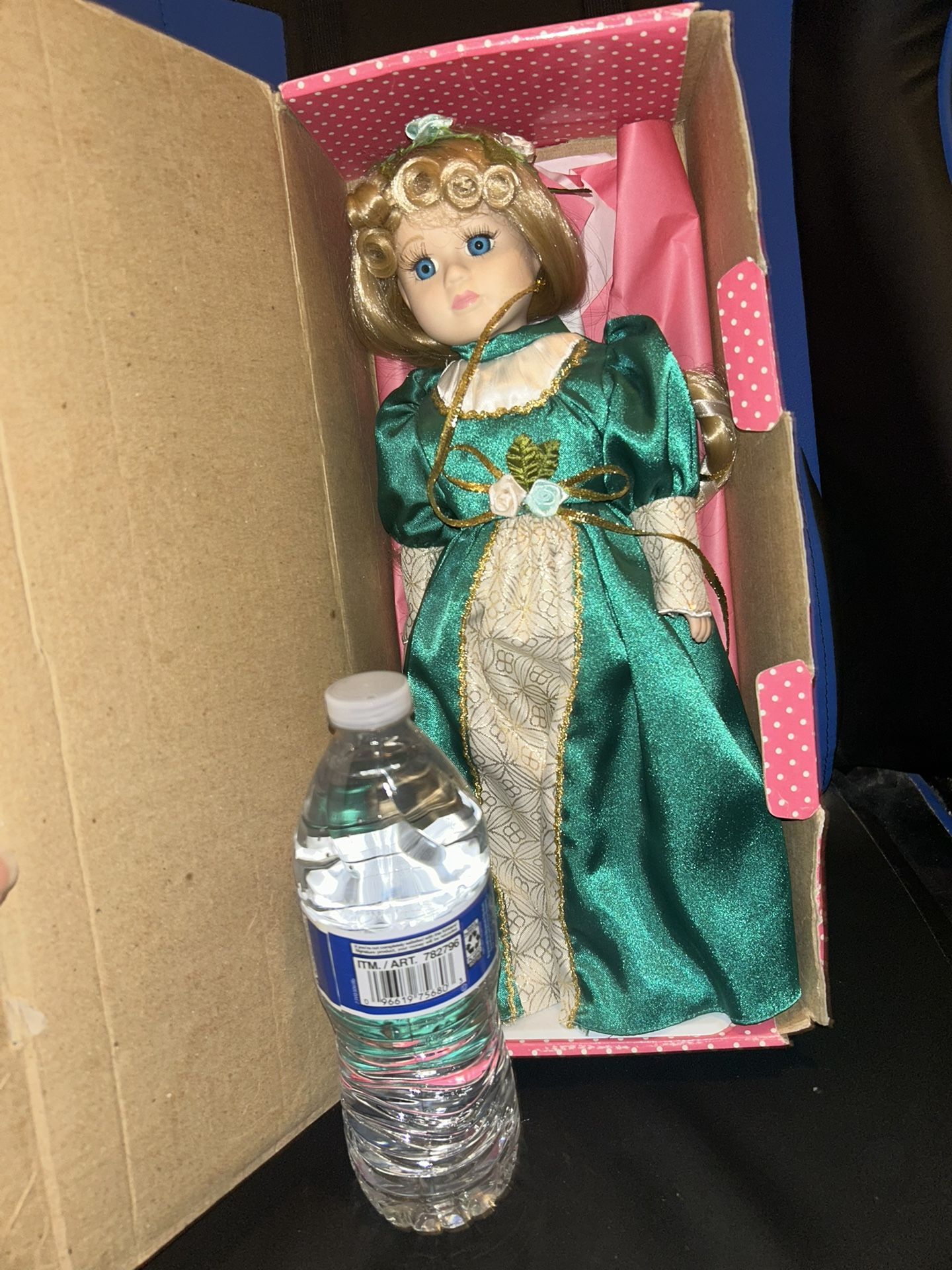 New In Box Porcelain doll.