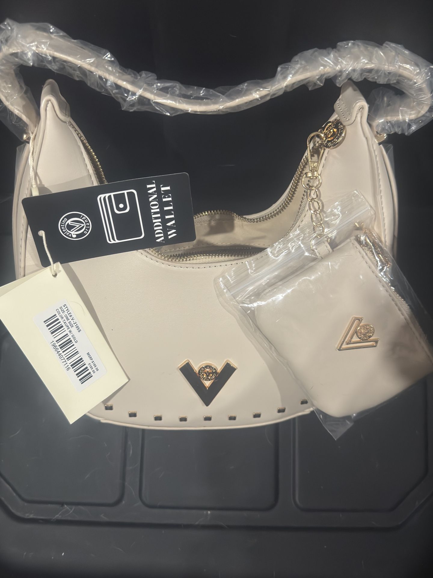 This is a Valentino Orlandi vegan leather bag.