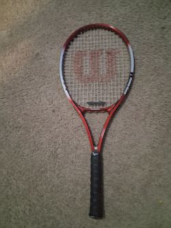 Neon red wilson tennis racket