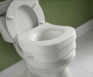 Brand New Delta Elevated Toilet Seat in White