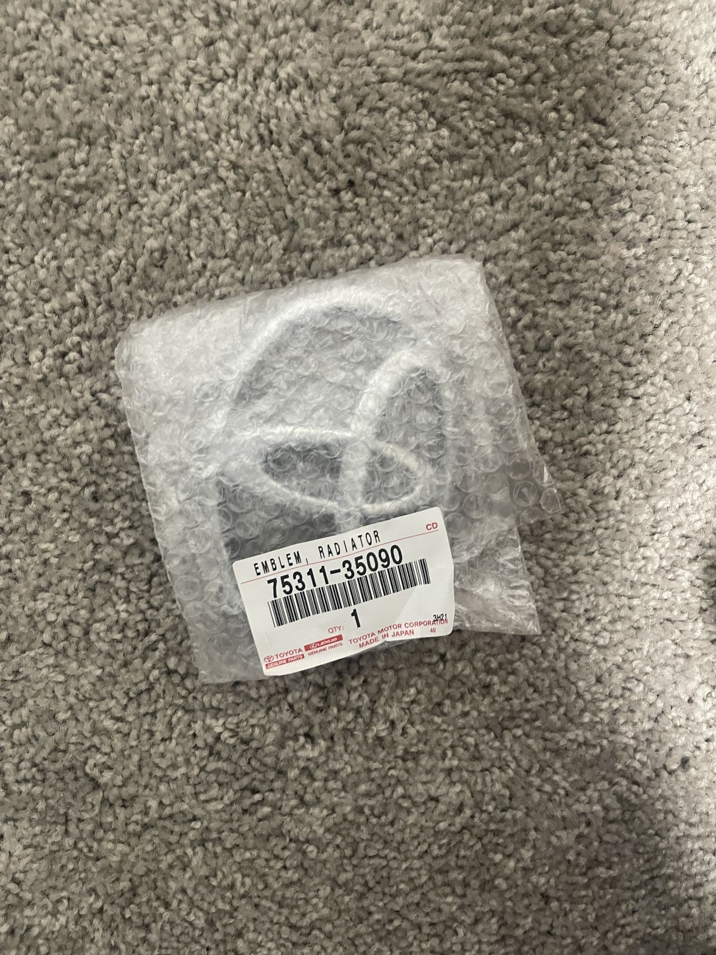 Genuine Front Grille Emblem OEM Toyota Logo Symbol