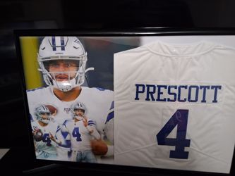 DAK PRESCOTT WITH THE DALLAS COWBOYS STITCHED,FRAMED JERSEY.