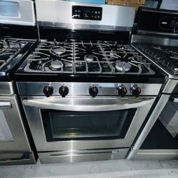 Frigidaire stainless steel gas stove, includes a receipt with a 60-day warranty.