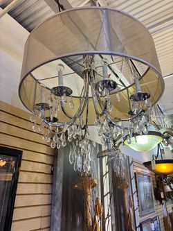 Beautiful modern chandelier.   Has all the hanging crystals, not fully showed in photo… 32” around , x 21” high   $300