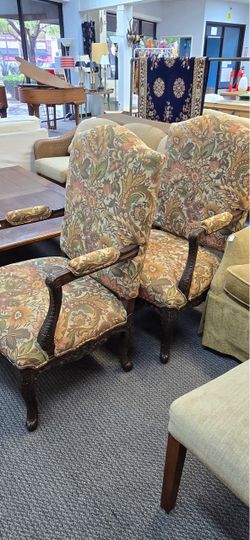 2 mid-20th-century Georgian-style or French-influenced carved wood armchair featuring a high, arched backrest, cabriole legs, and a rich multi-colored