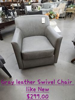 Chair Gray Leather Swivel We are located at 2811 East Bell road. Another Time Around Furniture.