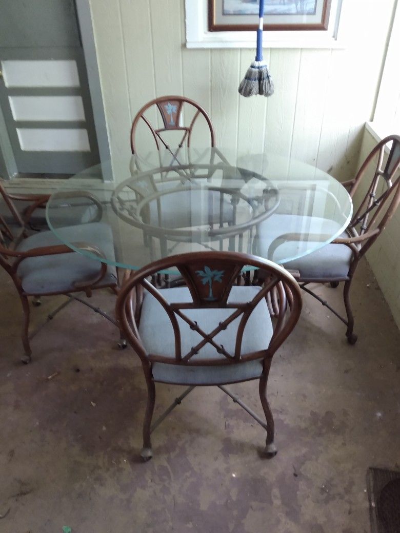 Glass Top Table.4 Chairs.The Base And Chairs Are Steel But Look Bamboo.