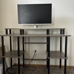 A Desk And Monitor 