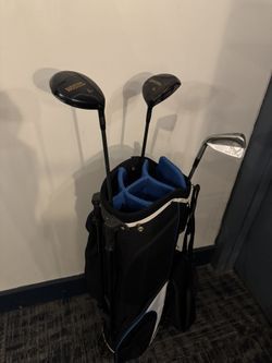 golf bag and 3 clubs