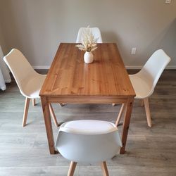 Brown Table with 4 White Chairs with Padding