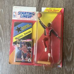 This item is a 1992 Starting Lineup Michael Jordan action figure in his Chicago Bulls warmup suit, still sealed in its original packaging.  It include