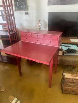 Red desk with fold out table