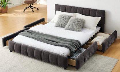 Gray bed frame with 4 built-in storage drawers. Original price: $668. Selling for $300. Great condition and provides extra storage space.