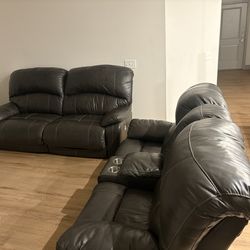 Gray leather reclining couches
