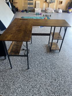 Work L-shaped desk, brown, with power outlet.