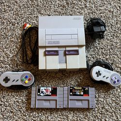 SNES With 2 Controllers And 2 Games